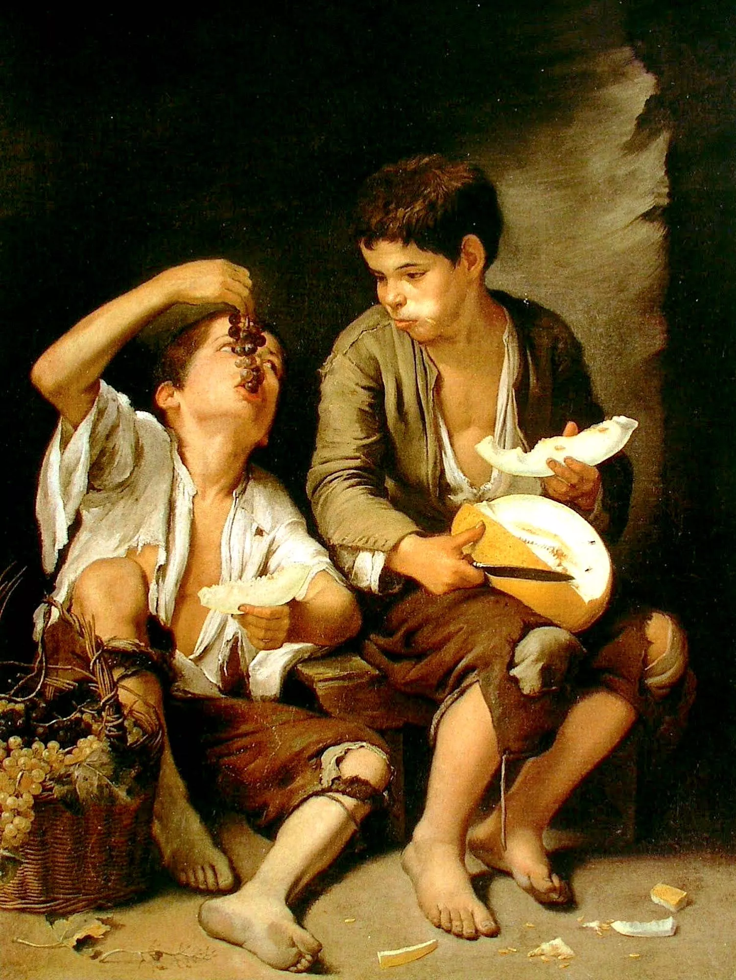 Niños comiendo uvas y melón